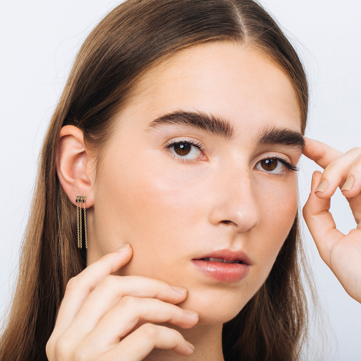Special gold and black diamond earrings combined with swinging necklaces