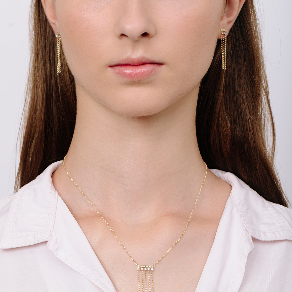 Special gold and diamond earrings combined with swinging necklaces