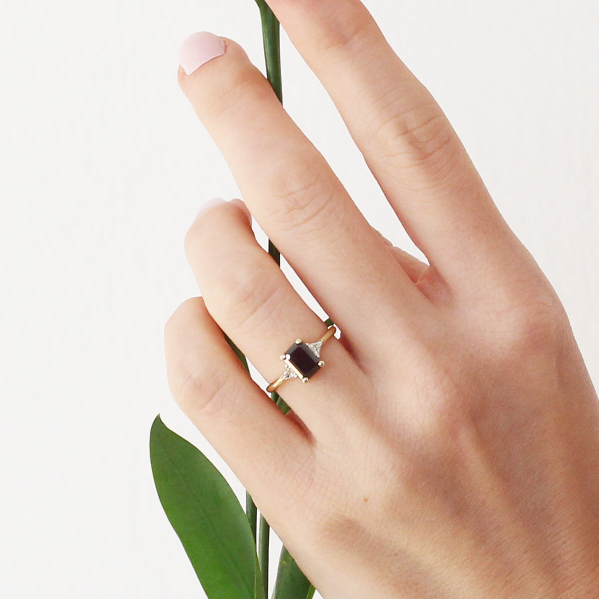 Rectangular black diamond ring and white triangular diamonds