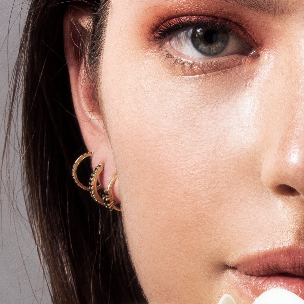 Small hoop earrings set with 3 black diamonds