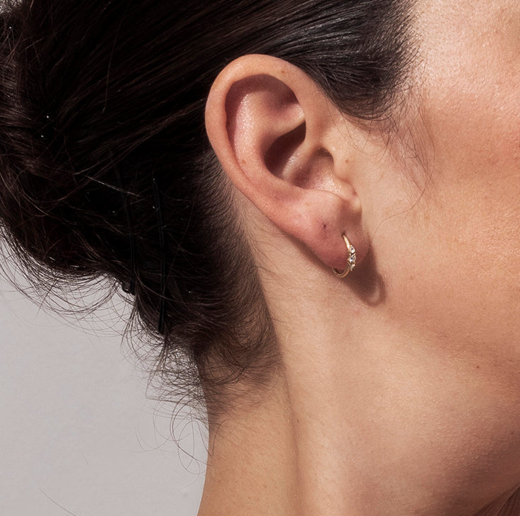 Small hoop earrings set with 3 diamonds