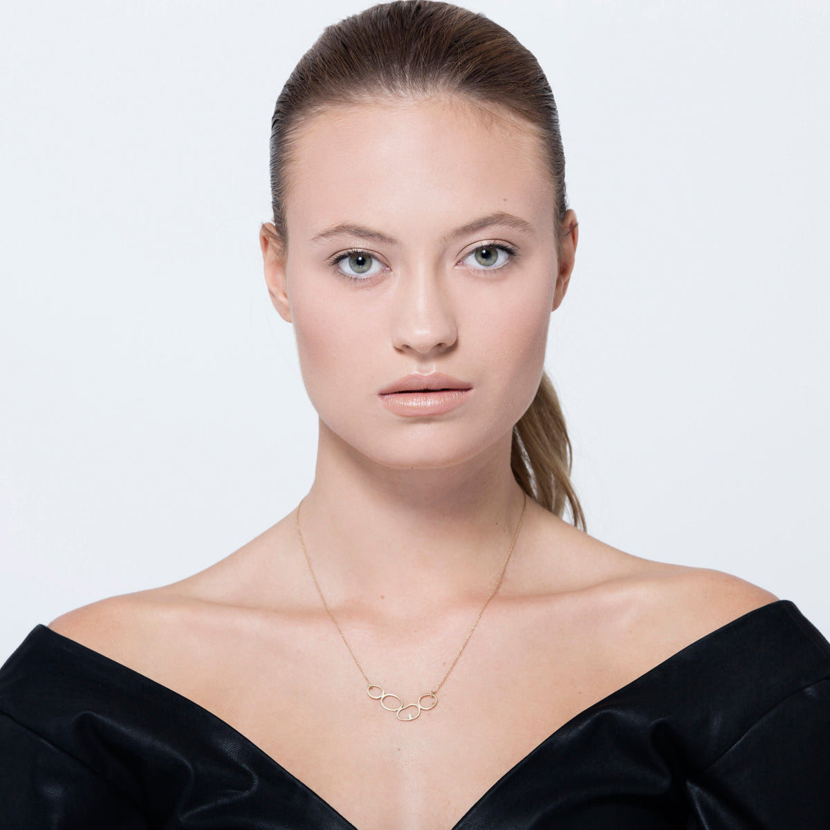 A special gold chain designed from 4 amorphous circles and a diamond