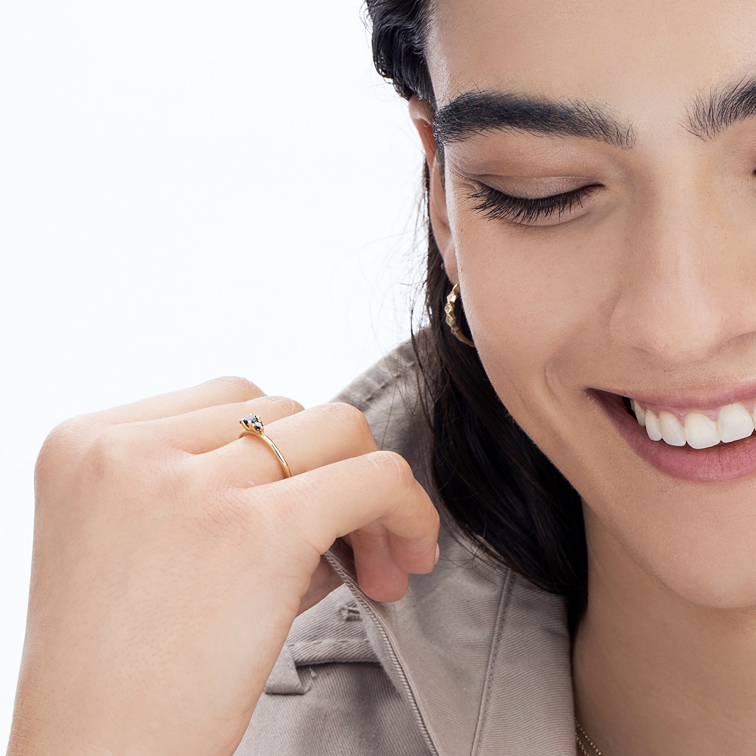 A fine gold ring set with three black diamonds