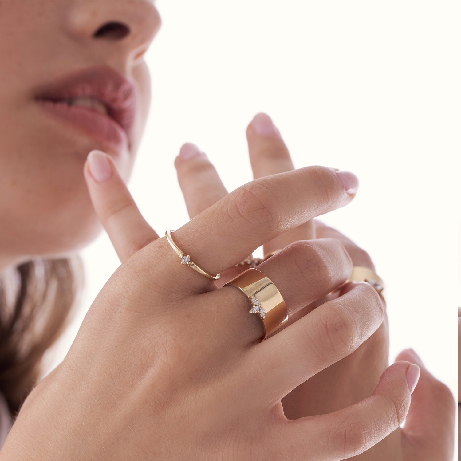 A delicate solitaire ring set with a diamond weighing 5 points