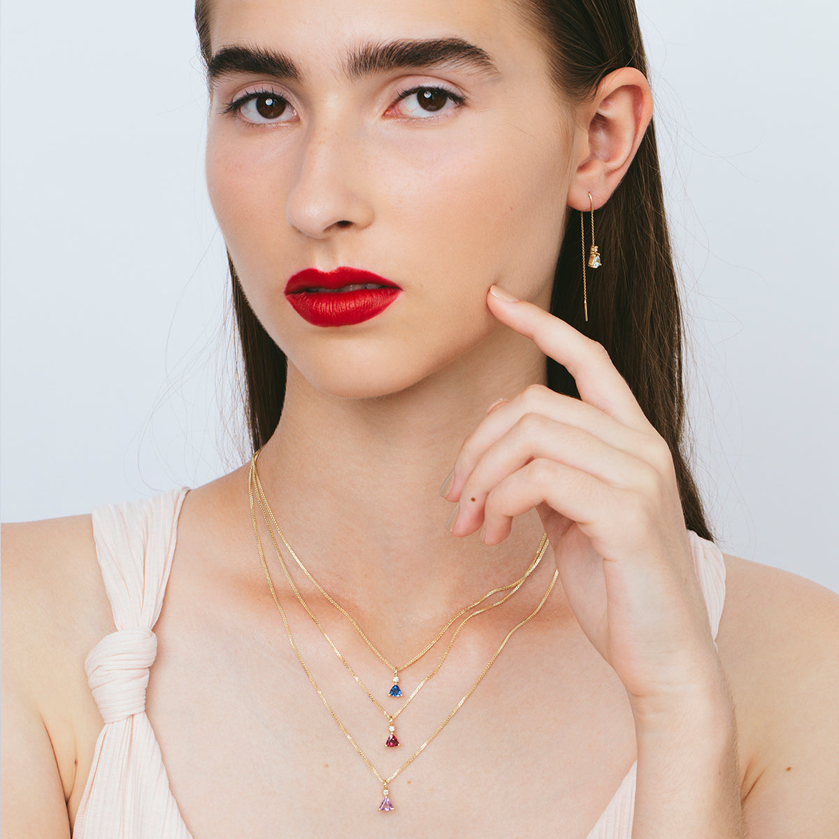 Gold necklace with rhodolite and diamond studded pendant