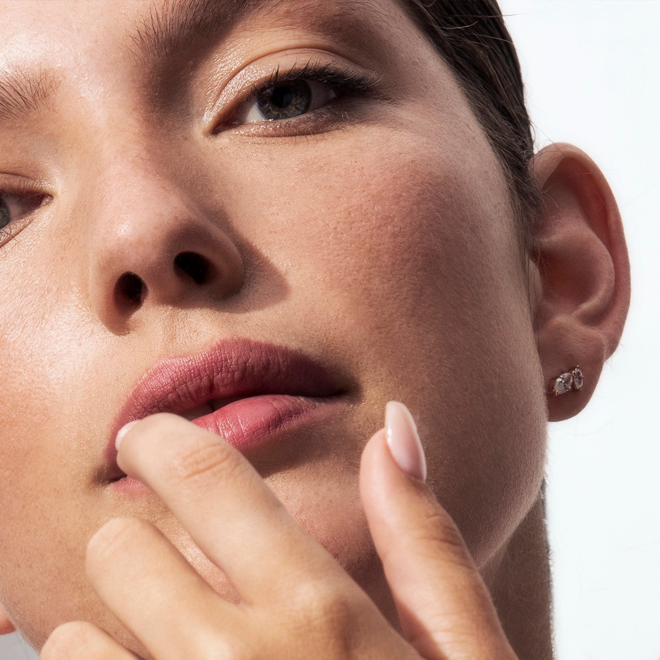 Tight gold earrings studded with marquise-cut diamonds