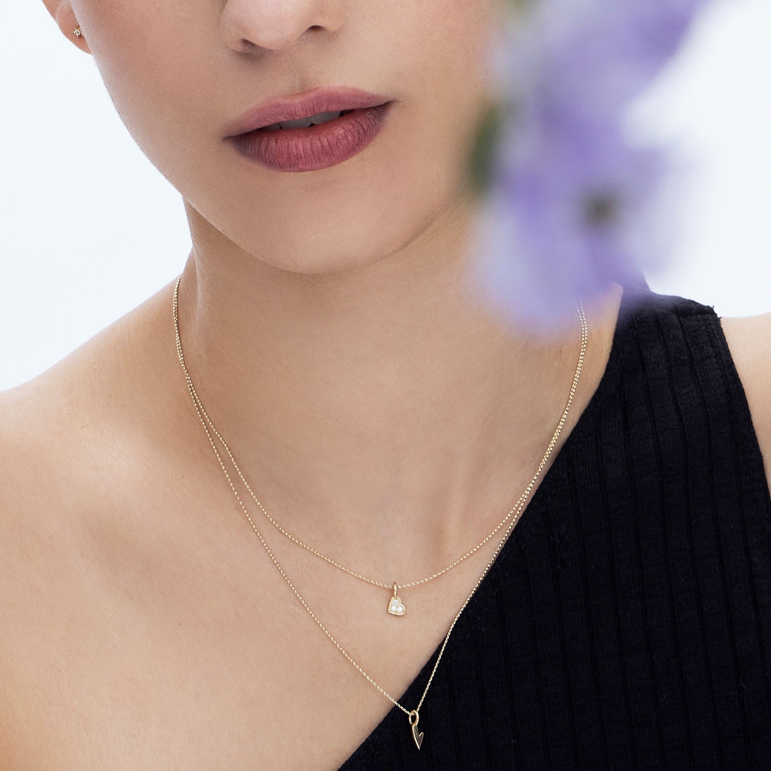 Delicate gold necklace with a heart pendant