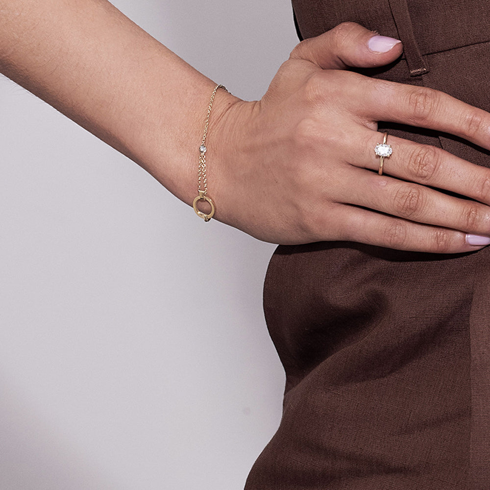 A special asymmetric gold bracelet in a modern and impressive design set with a diamond