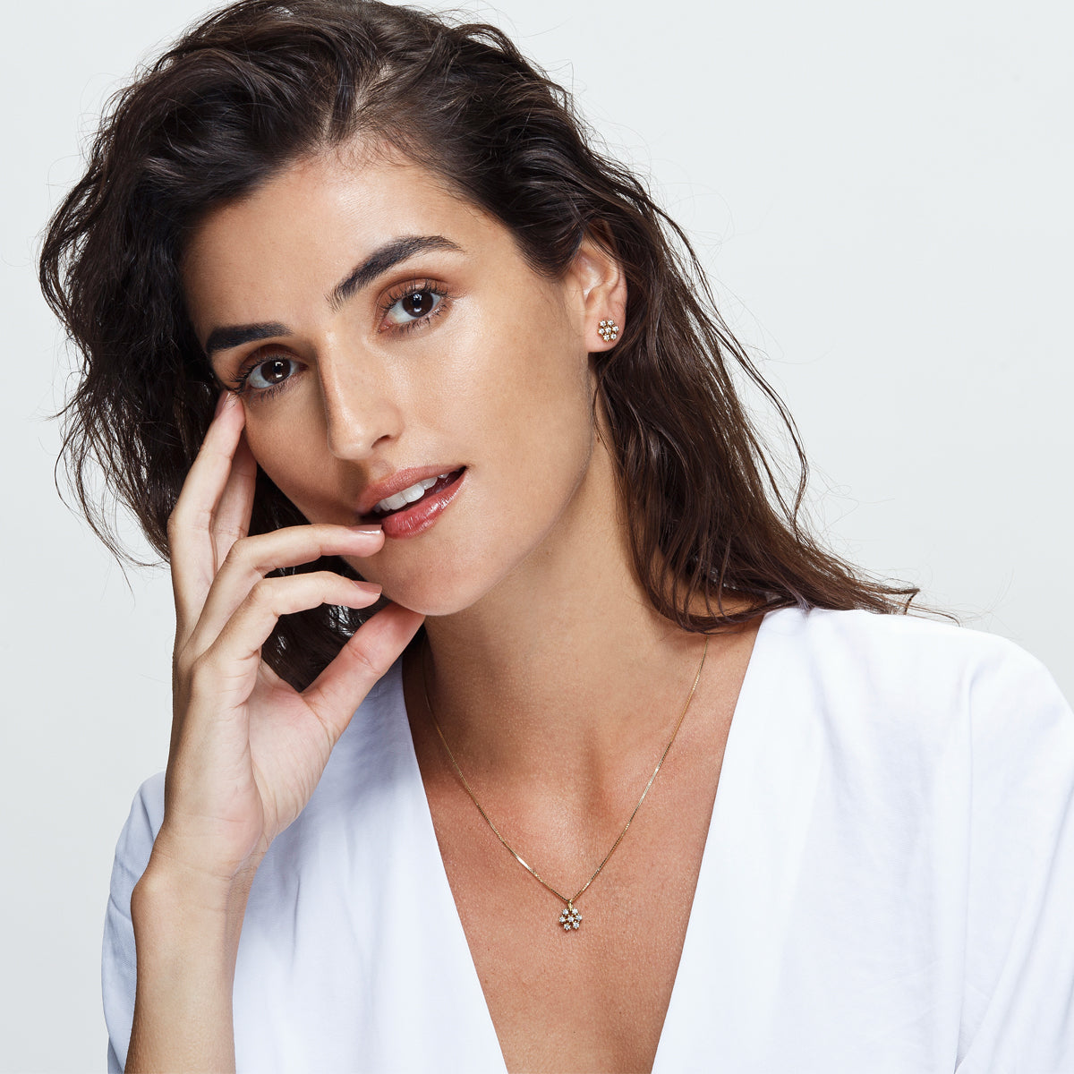 Studded diamond earrings inspired by a snowflake