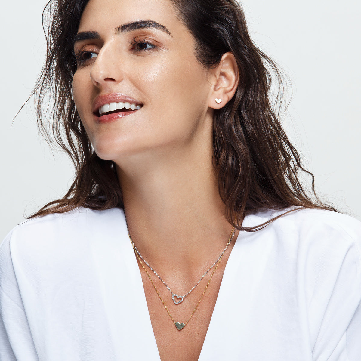 Gold earrings in the shape of a heart