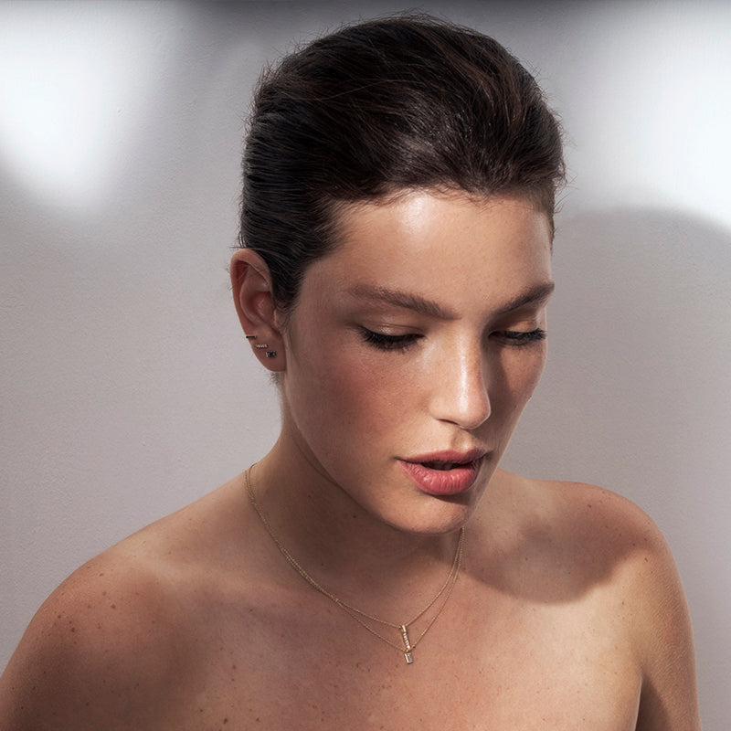 Attached diamond earrings with a frame studded with baguette-cut diamonds 0.20ct