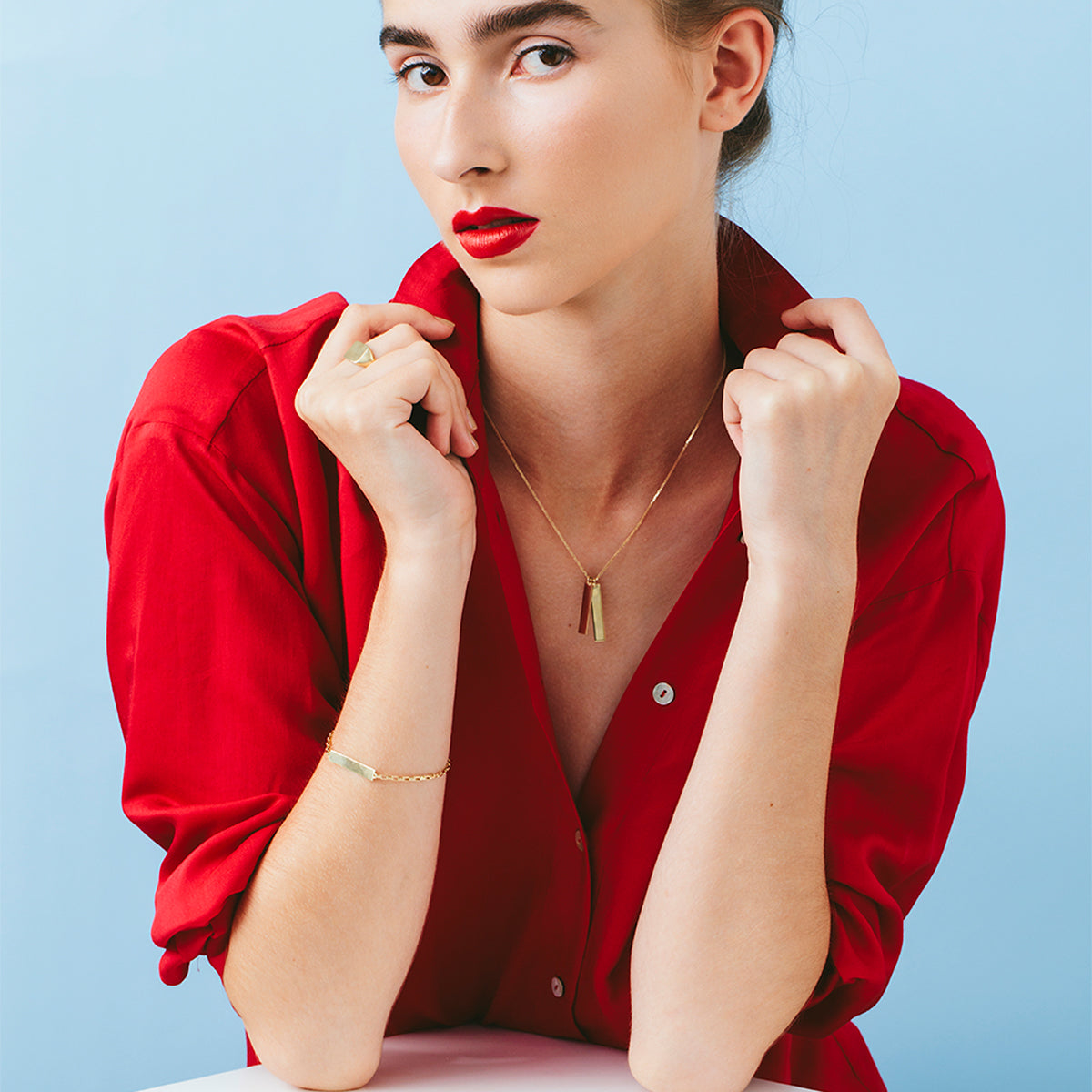 Gold bar name necklace in the shape of a rectangle