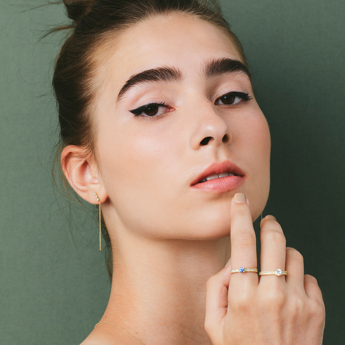 Attached white diamond earrings with a gold chain