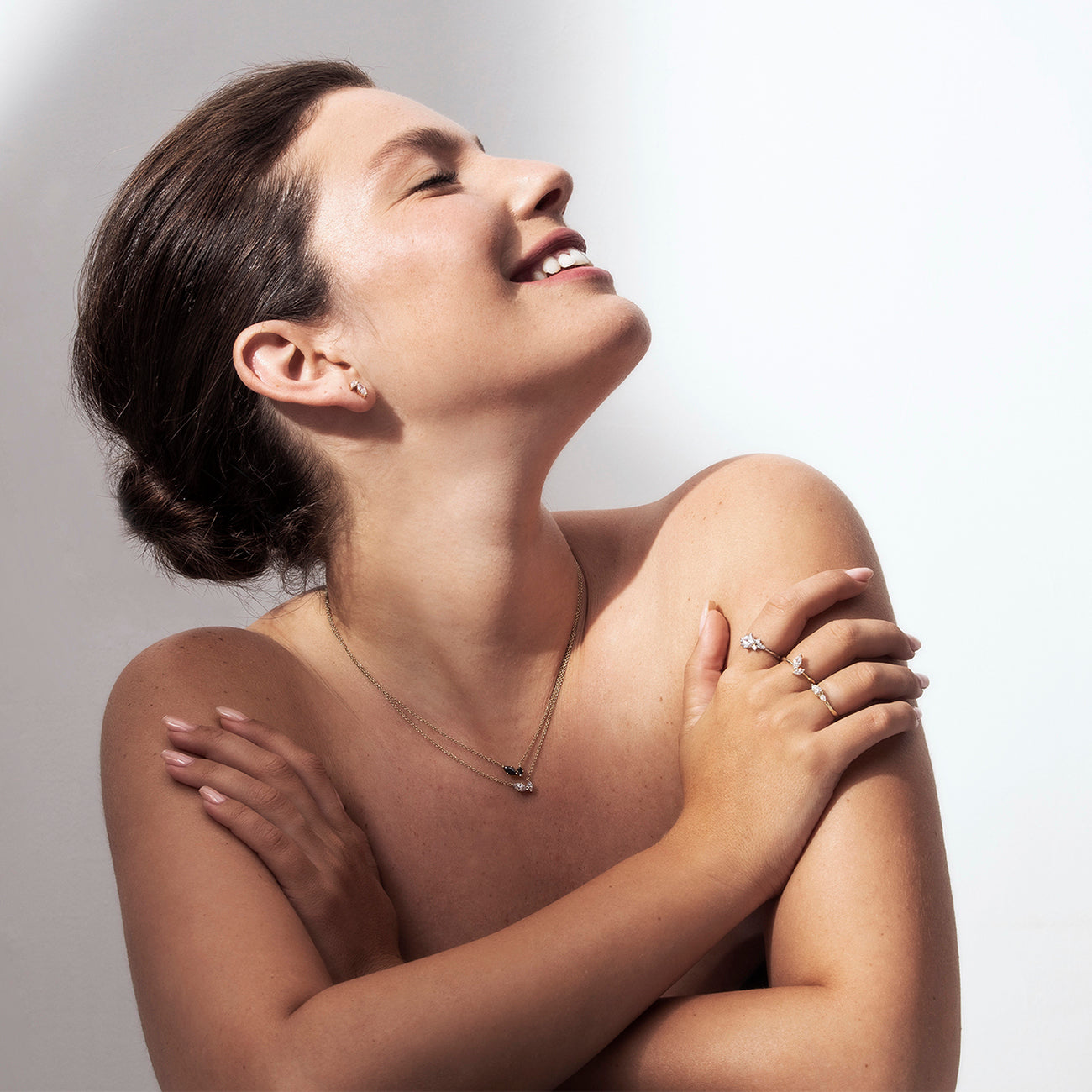 Princess gold ring set with a square lab diamond and round sided diamonds
