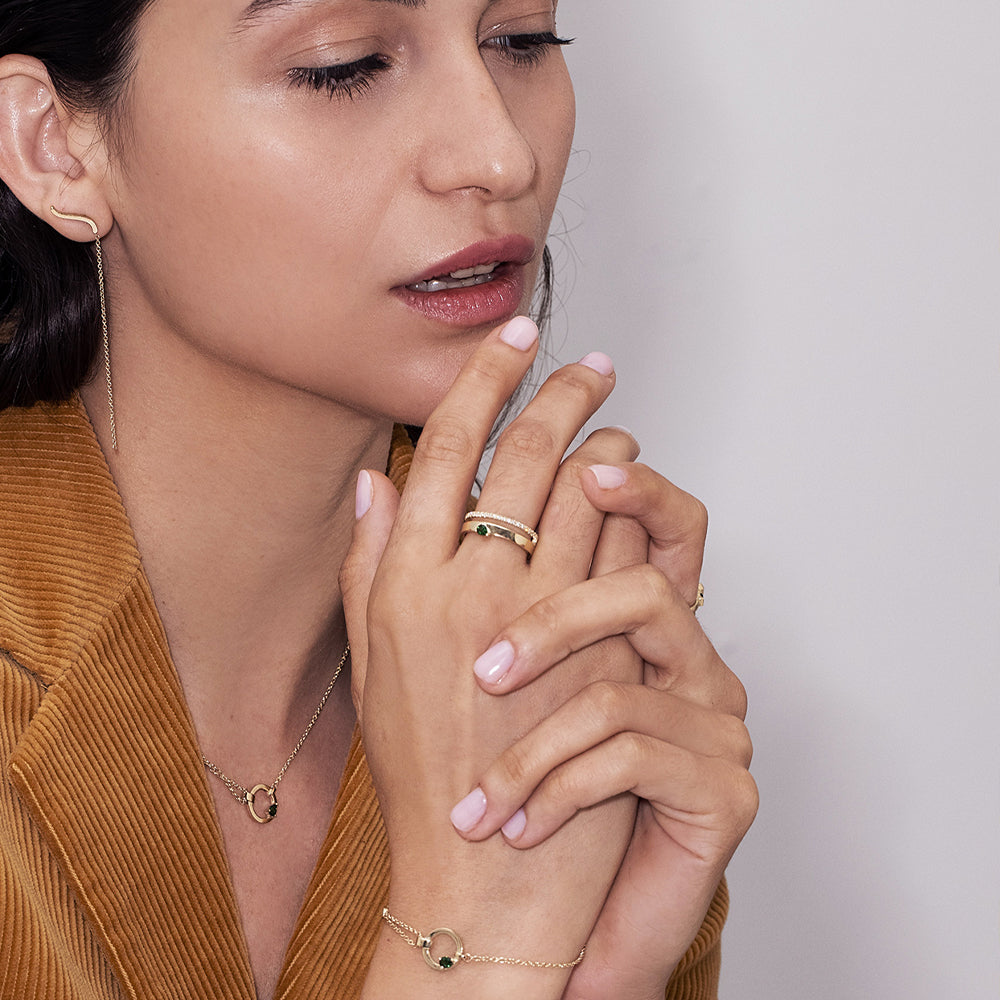 A thick, asymmetric and special gold chain, with a modern and impressive design. Set with tourmaline and diamond