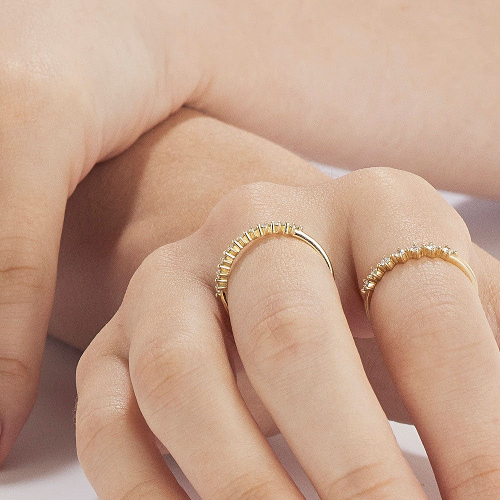 A delicate diamond ring set with 7 diamonds in a special setting