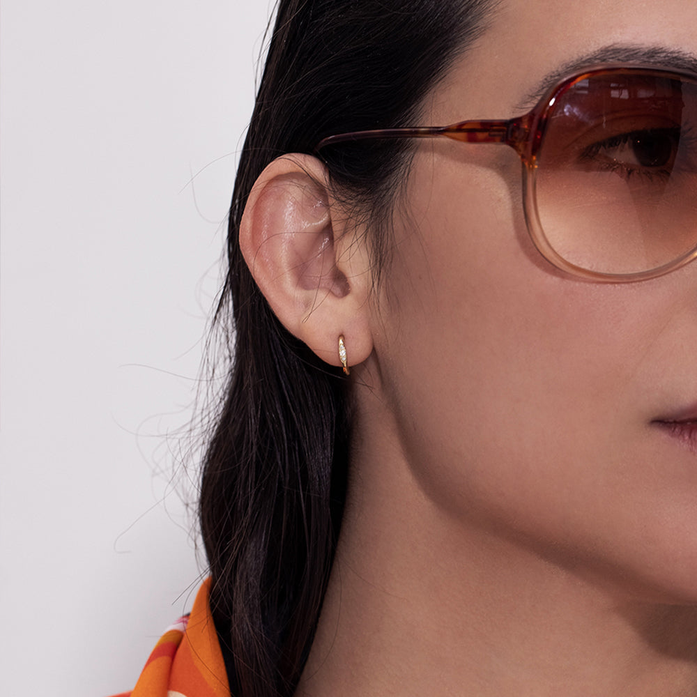 Small gold hoop earrings set with 3 diamonds