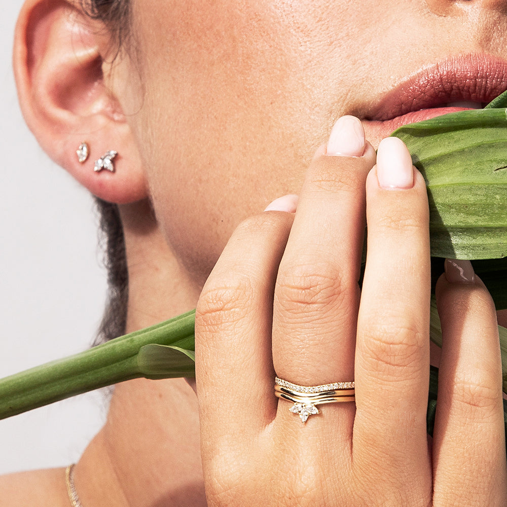 A gold ring with a fine wave set with diamonds