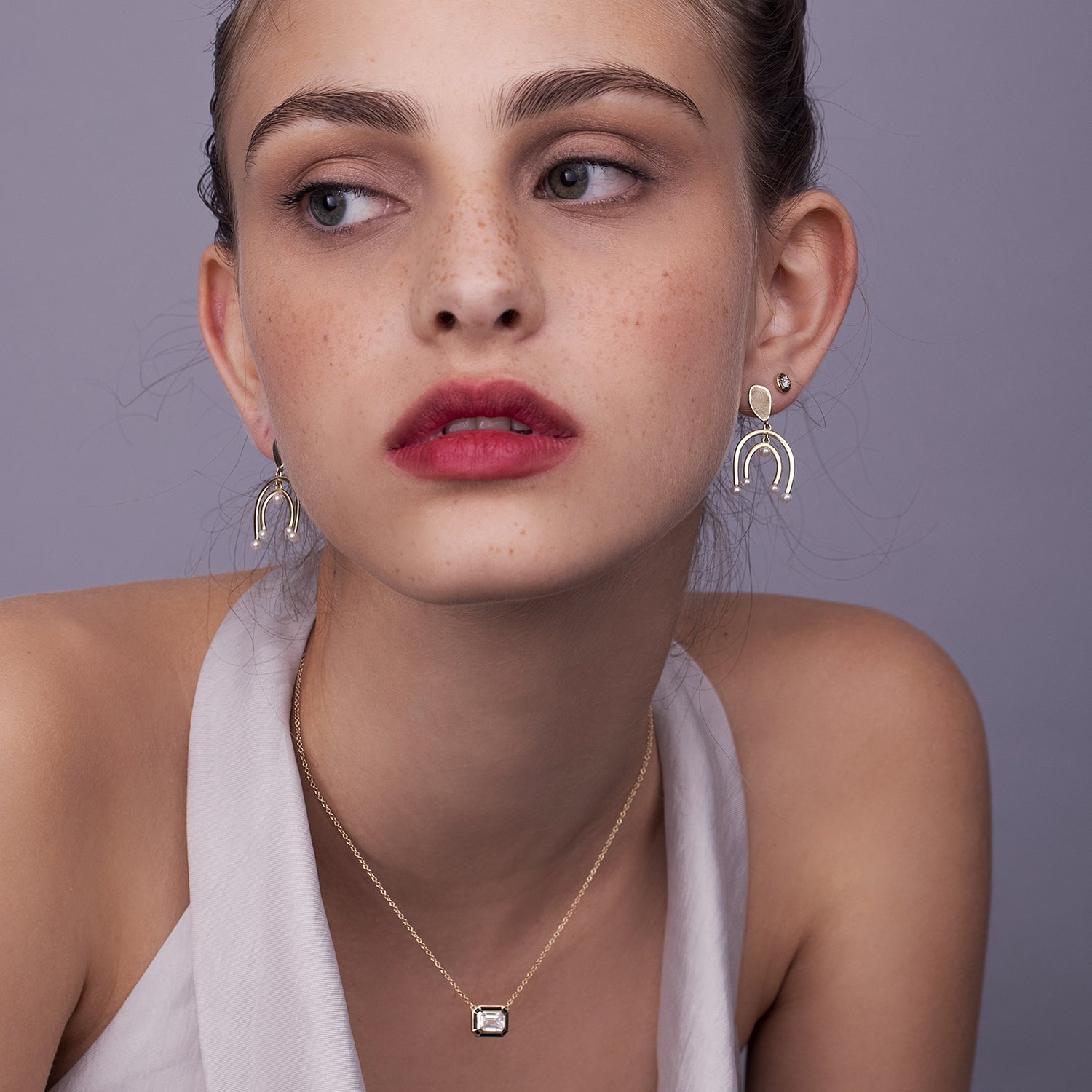 A special classic gold necklace with a 1 carat emerald cut laboratory diamond in a special enamel frame