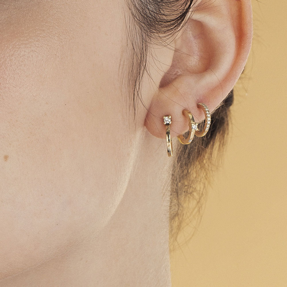 Classic small hoop earrings studded with white diamonds