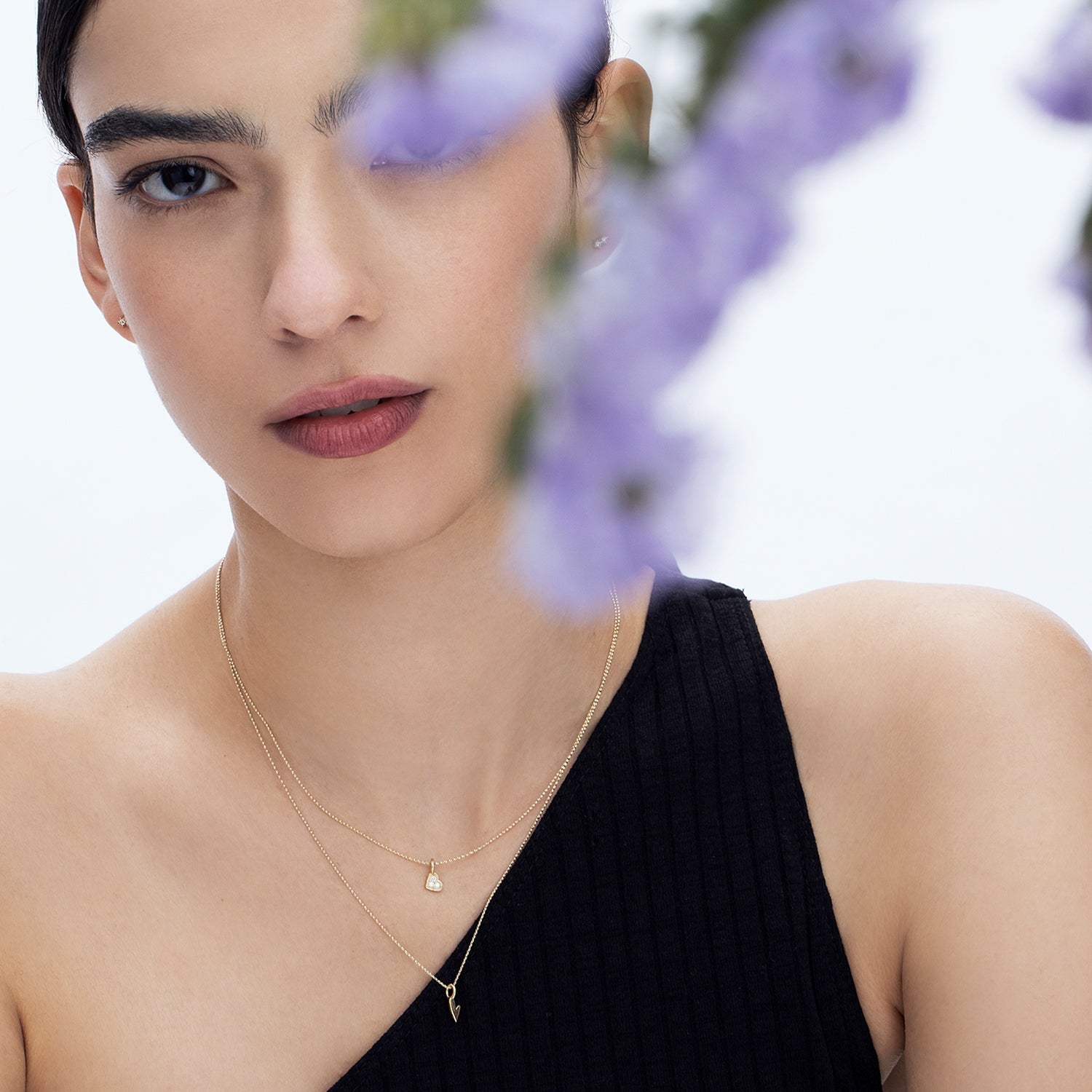 Delicate gold necklace with a heart pendant