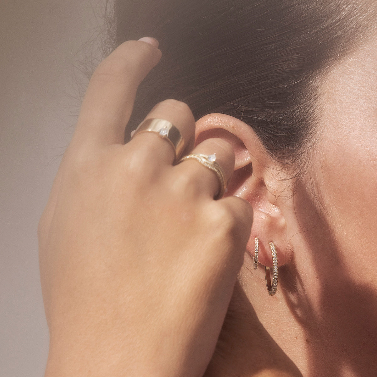 A delicate solitaire ring set with a drop-cut diamond