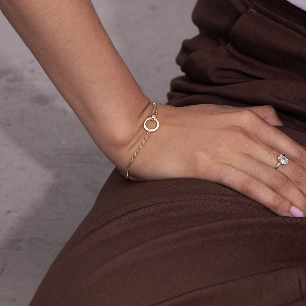 A special asymmetric gold bracelet in a modern and impressive design set with a diamond