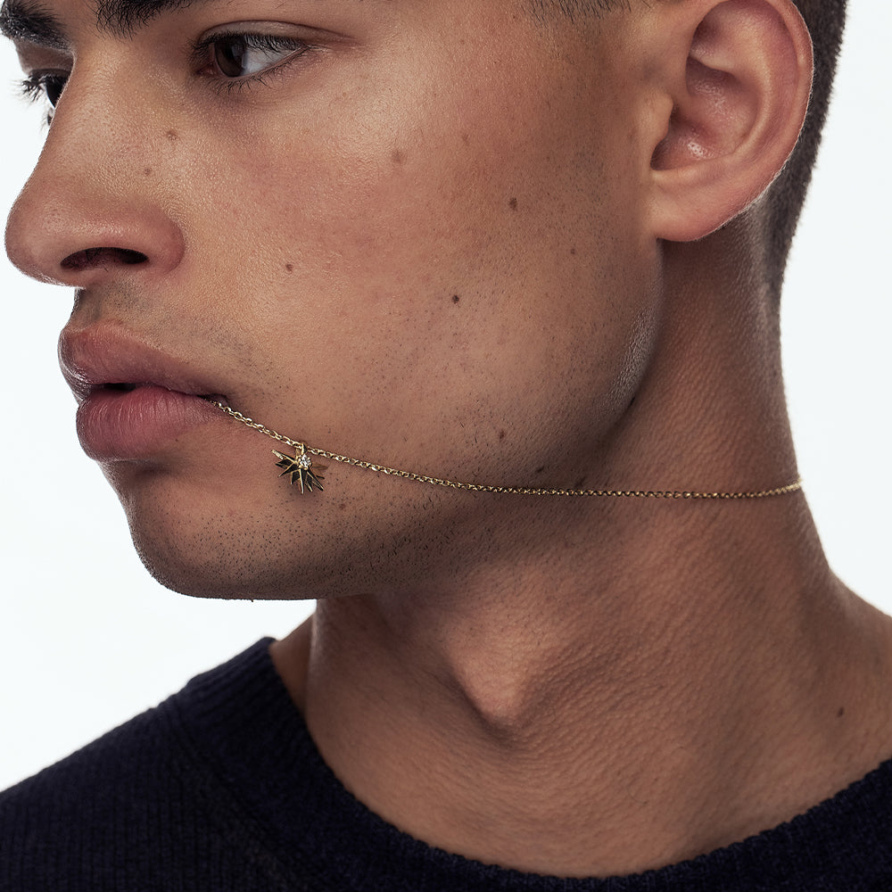 A special gold chain with a large half sun pendant