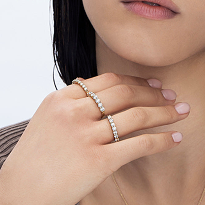 Gold ring set with 7 laboratory diamonds weighing 10 points per diamond, 70 points total