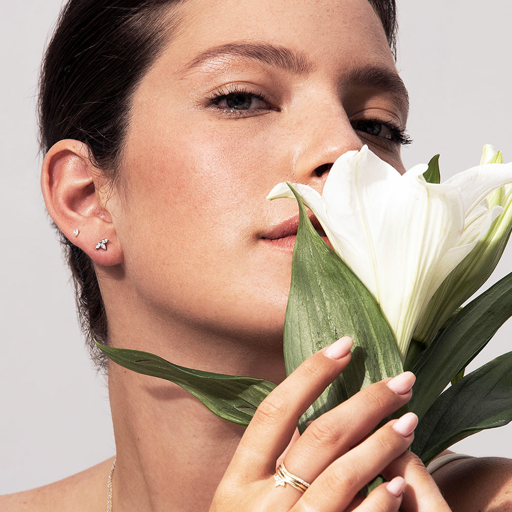 Gold solitaire earrings studded with marquise-cut diamonds