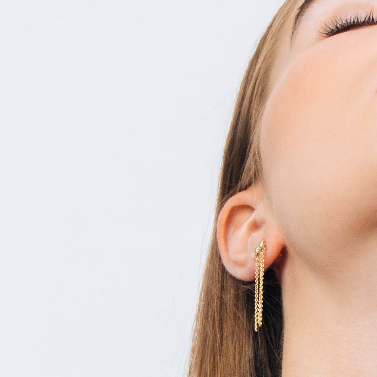 Special gold and diamond earrings combined with swinging necklaces