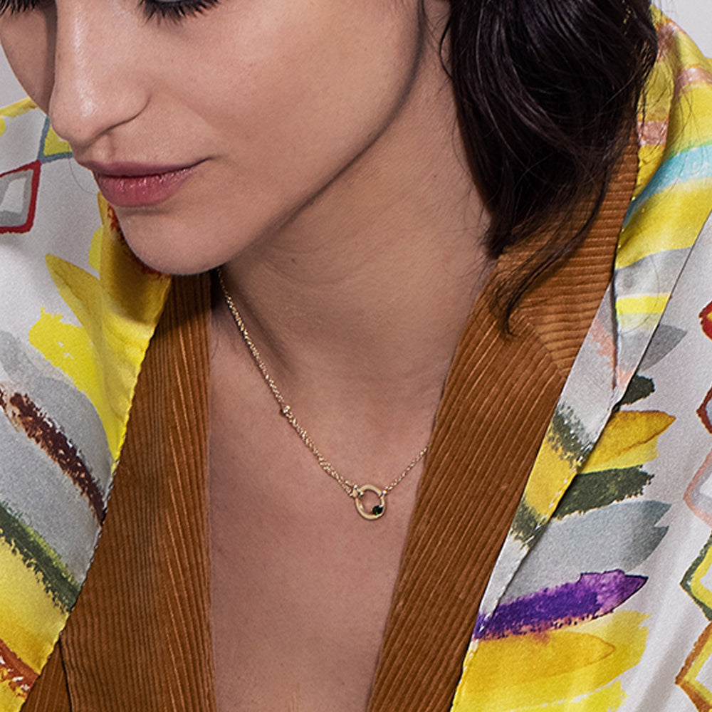 A thick, asymmetric and special gold chain, with a modern and impressive design. Set with tourmaline and diamond