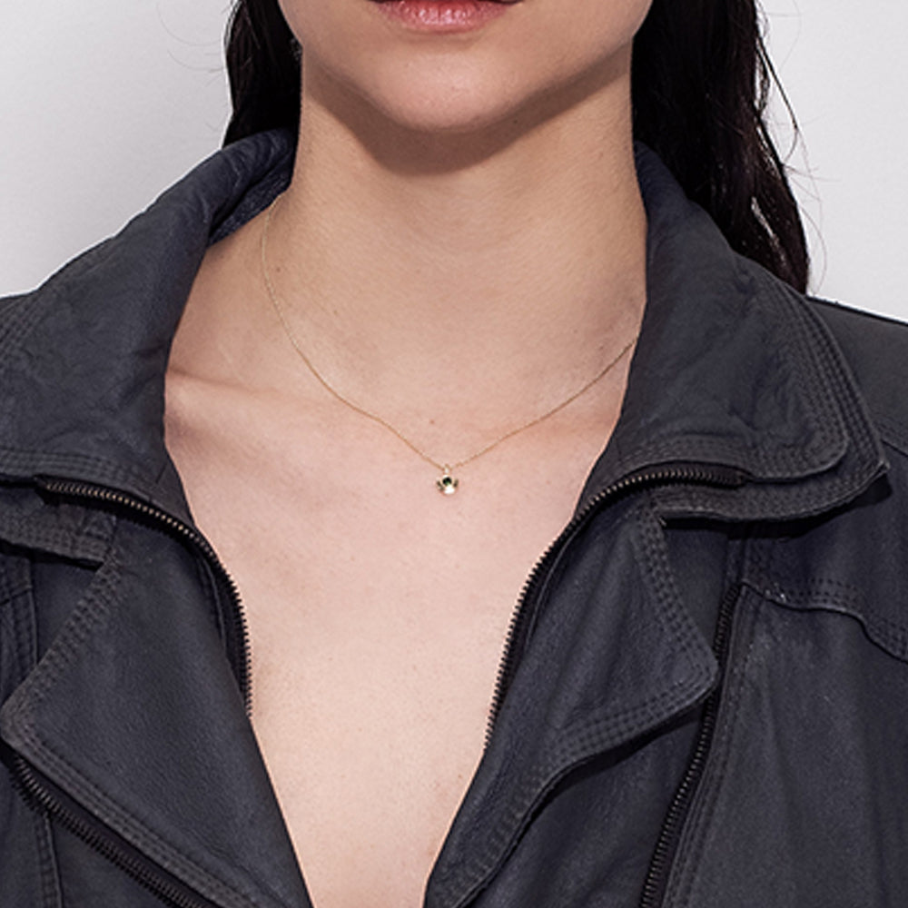 Gold necklace with a special pendant, semi-circular, inlaid with green tourmaline