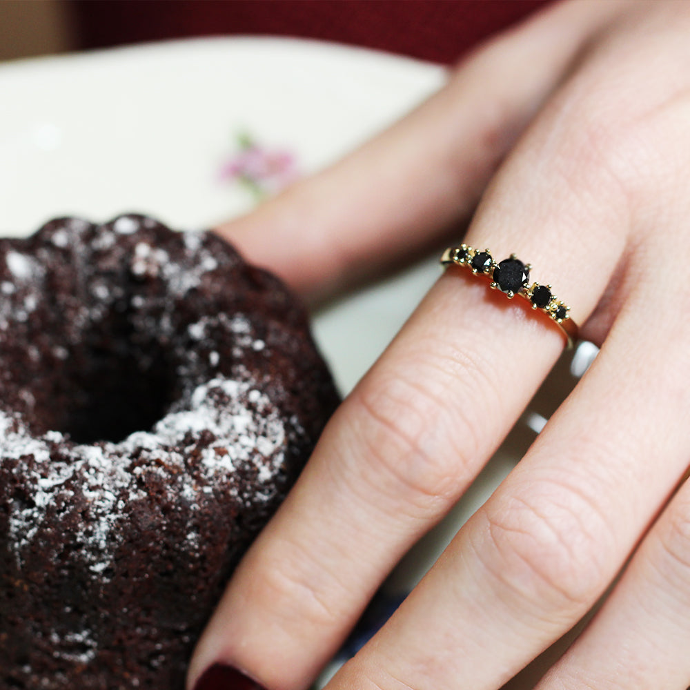Gold ring set with 5 black diamonds