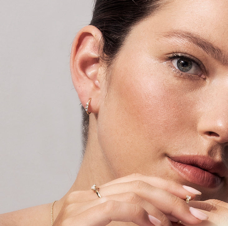 Small hoop earrings set with 3 diamonds