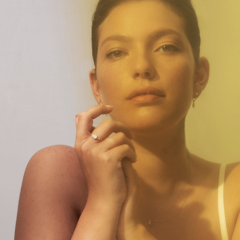 An engagement ring set with a half carat diamond and small asymmetric diamonds