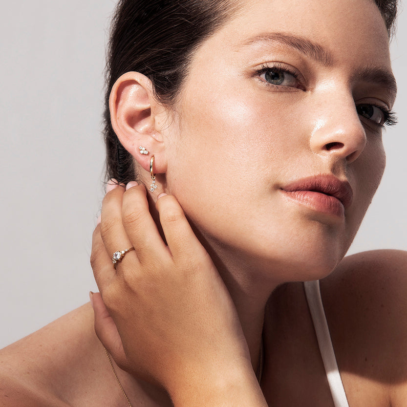 Gold hoop earrings with diamonds of varying sizes