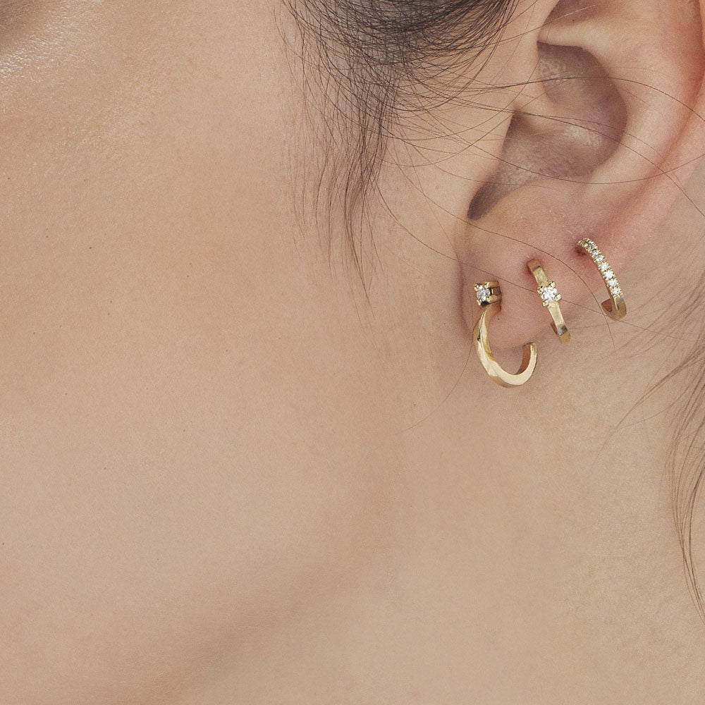Classic small hoop earrings studded with white diamonds