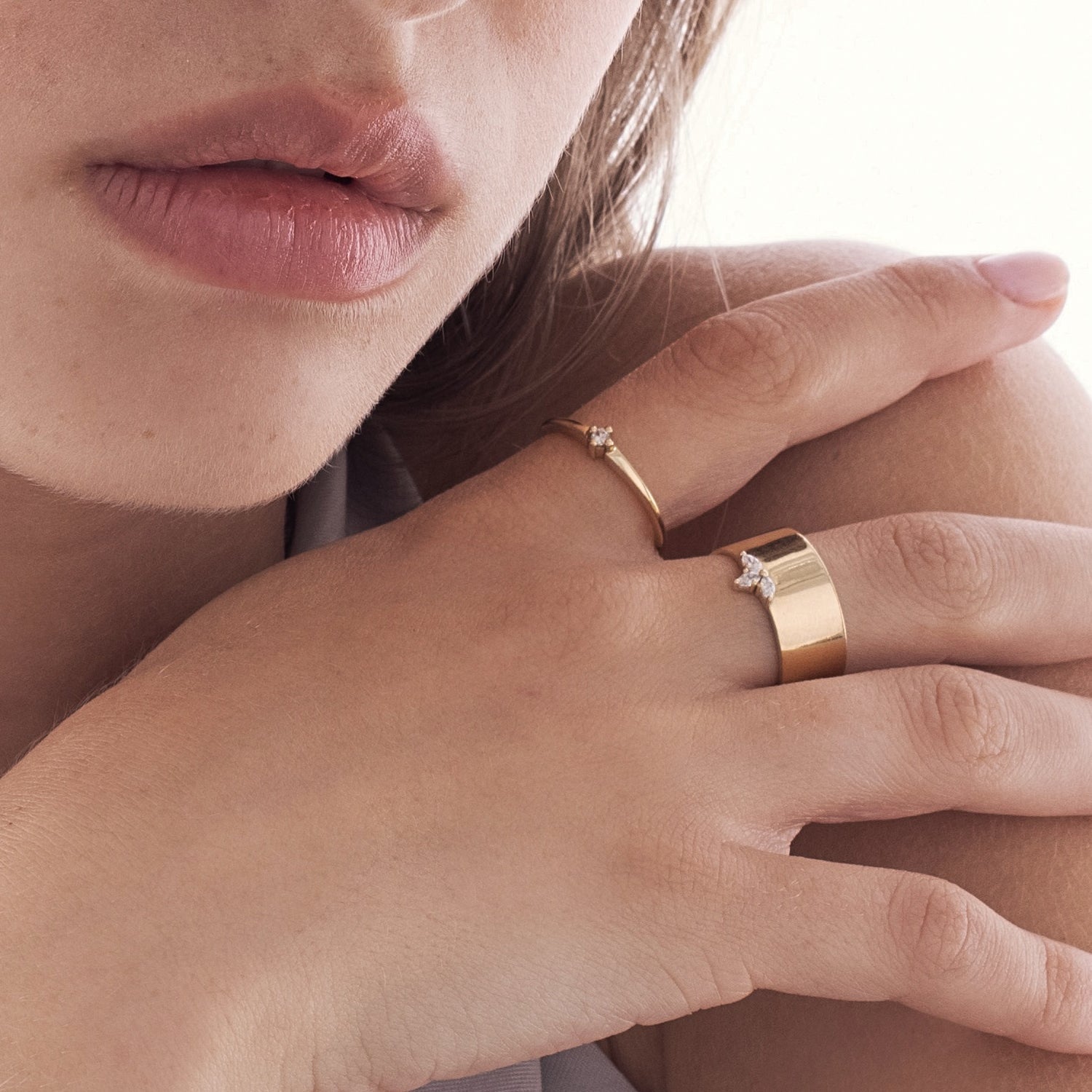 A delicate solitaire ring set with a diamond weighing 5 points