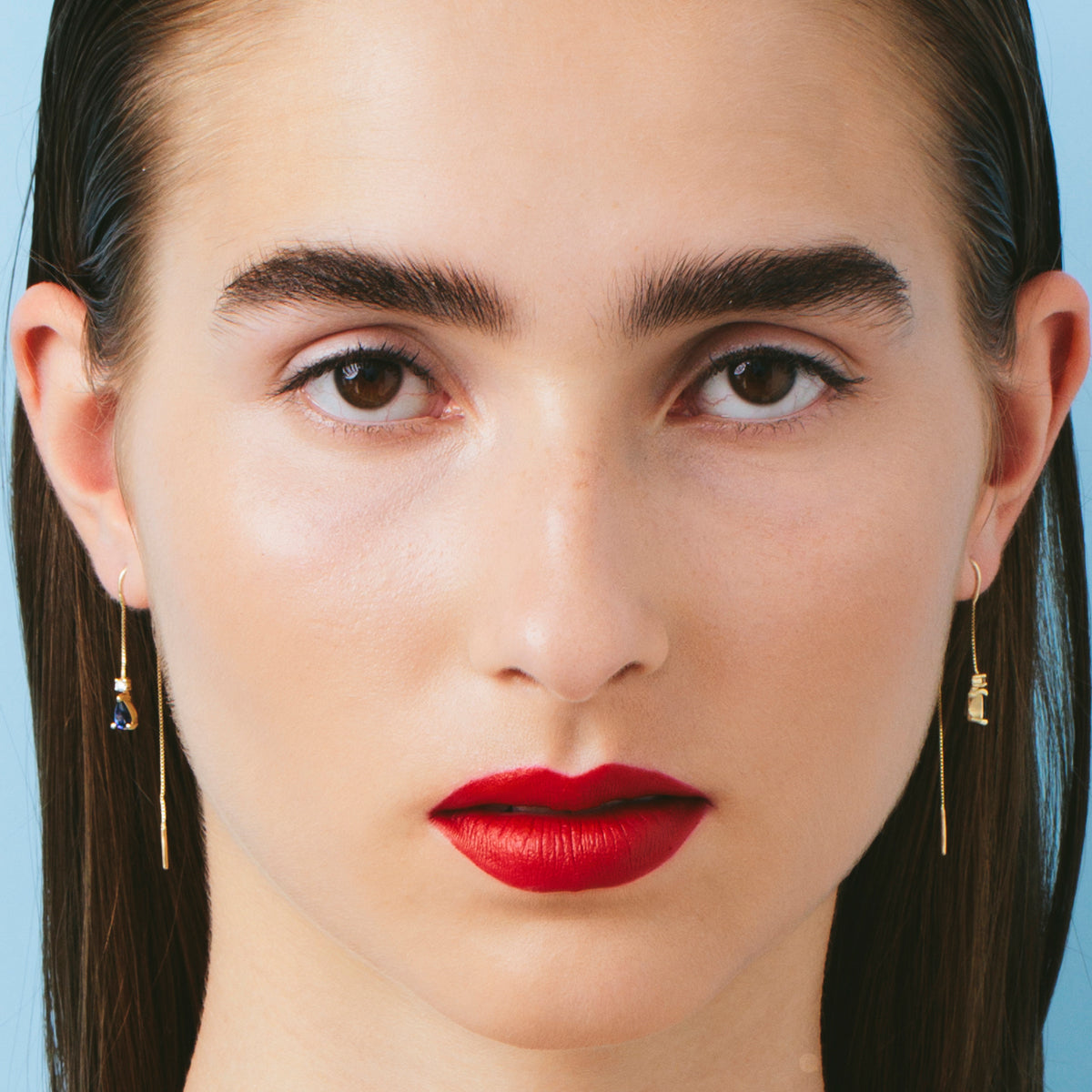 Dangling gold earrings with sapphires and diamonds