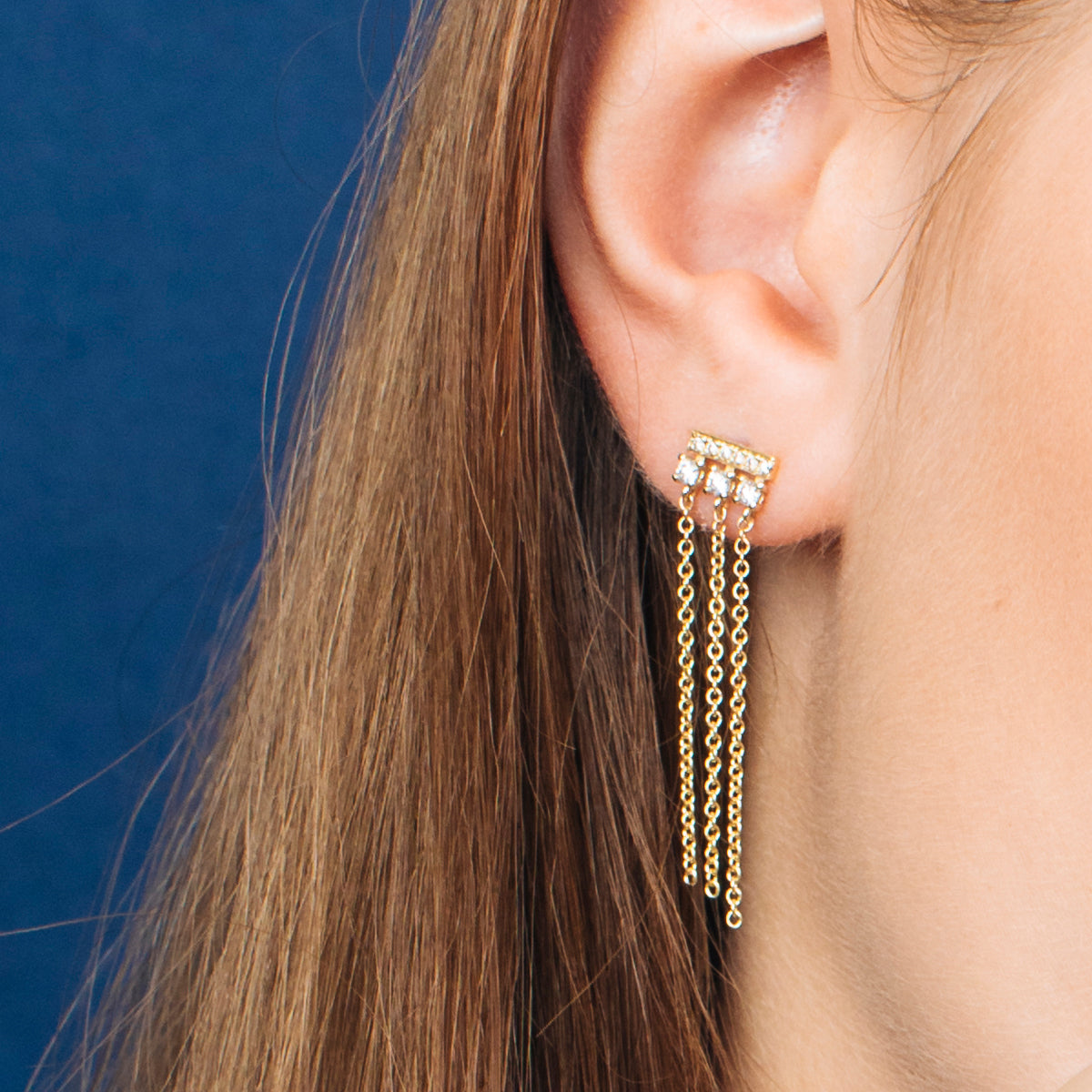 Special gold and diamond earrings combined with swinging necklaces