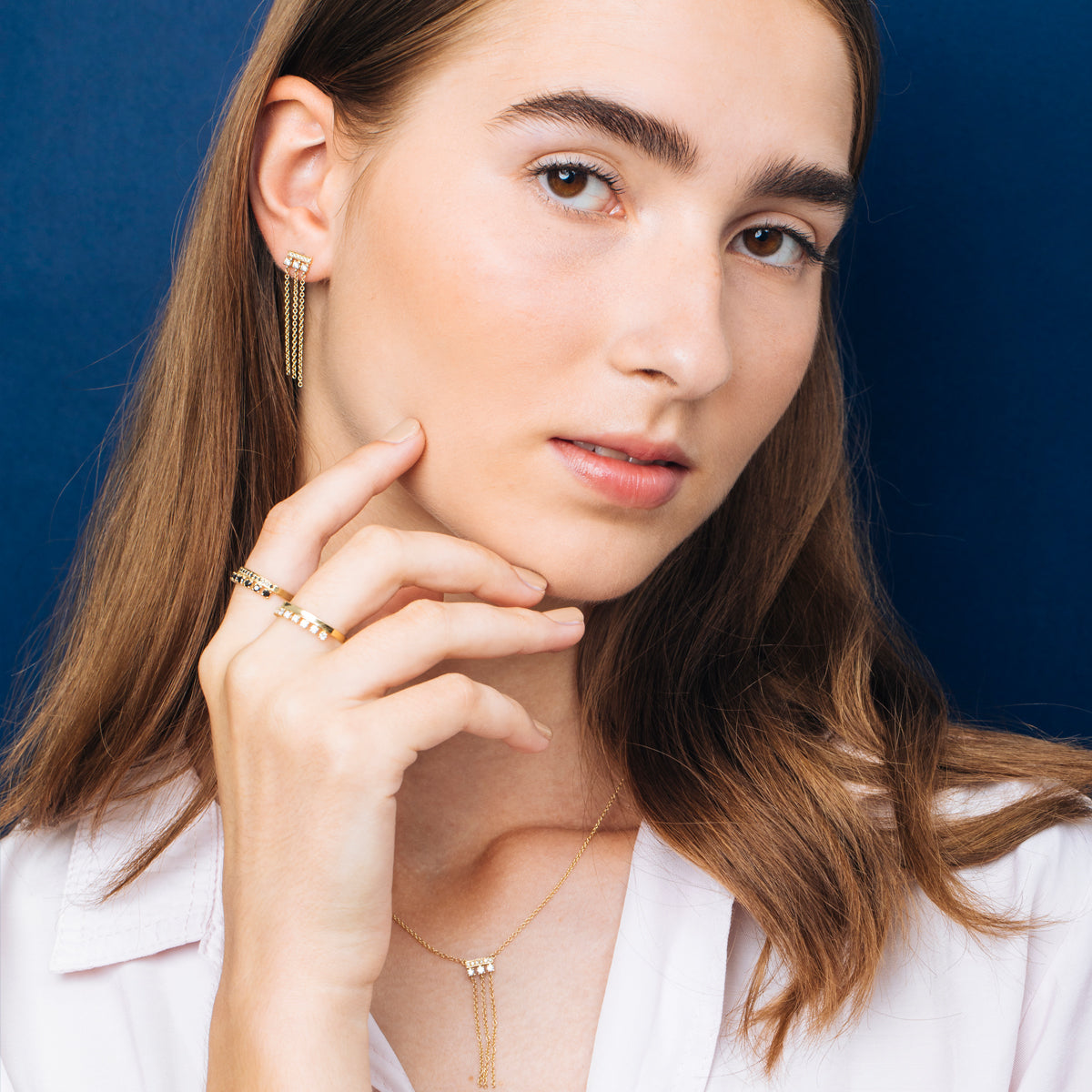 Special gold and diamond earrings combined with swinging necklaces