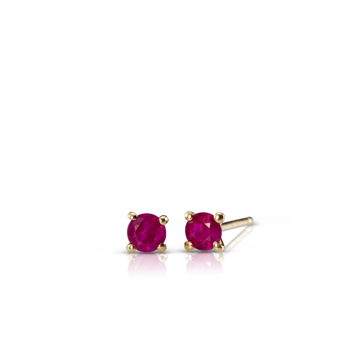 Gold solitaire earrings studded with ruby stones