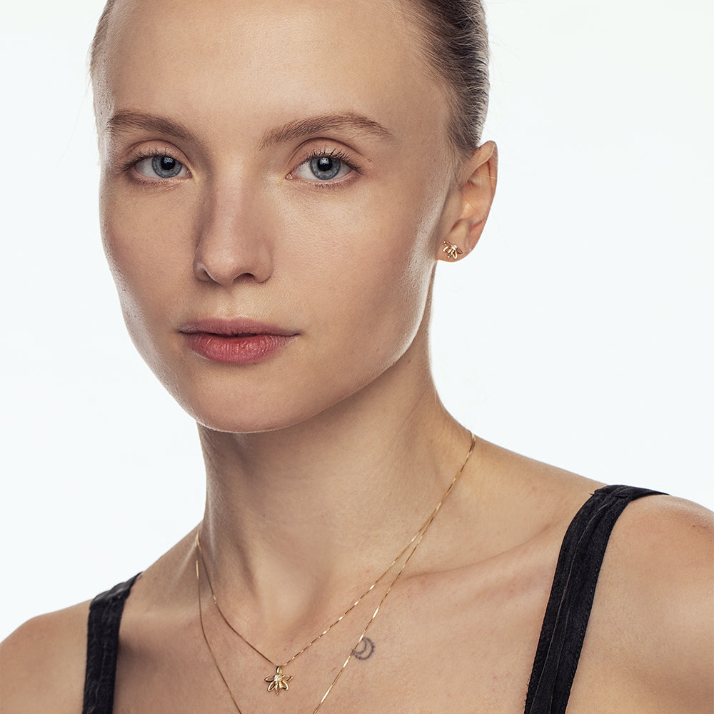 Delicate flower gold earrings set with laboratory diamonds