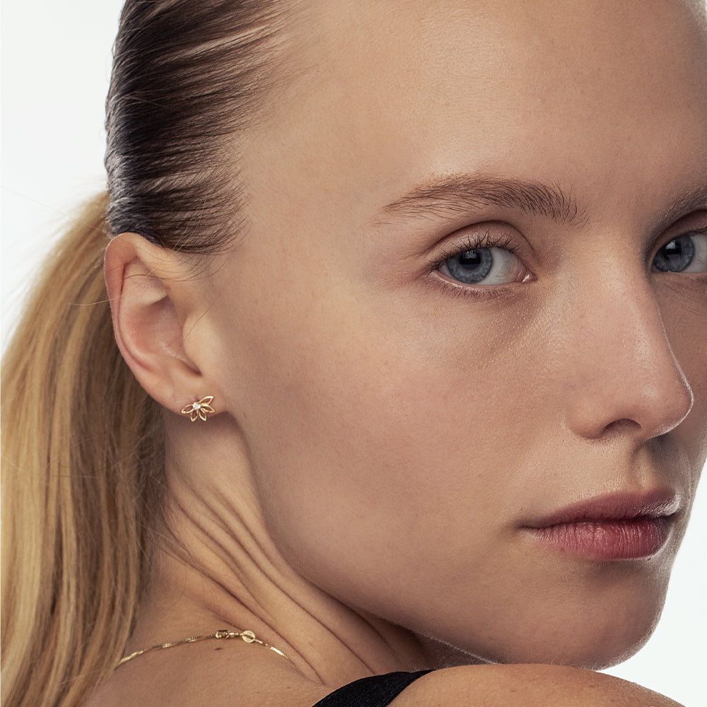 Delicate flower gold earrings set with laboratory diamonds