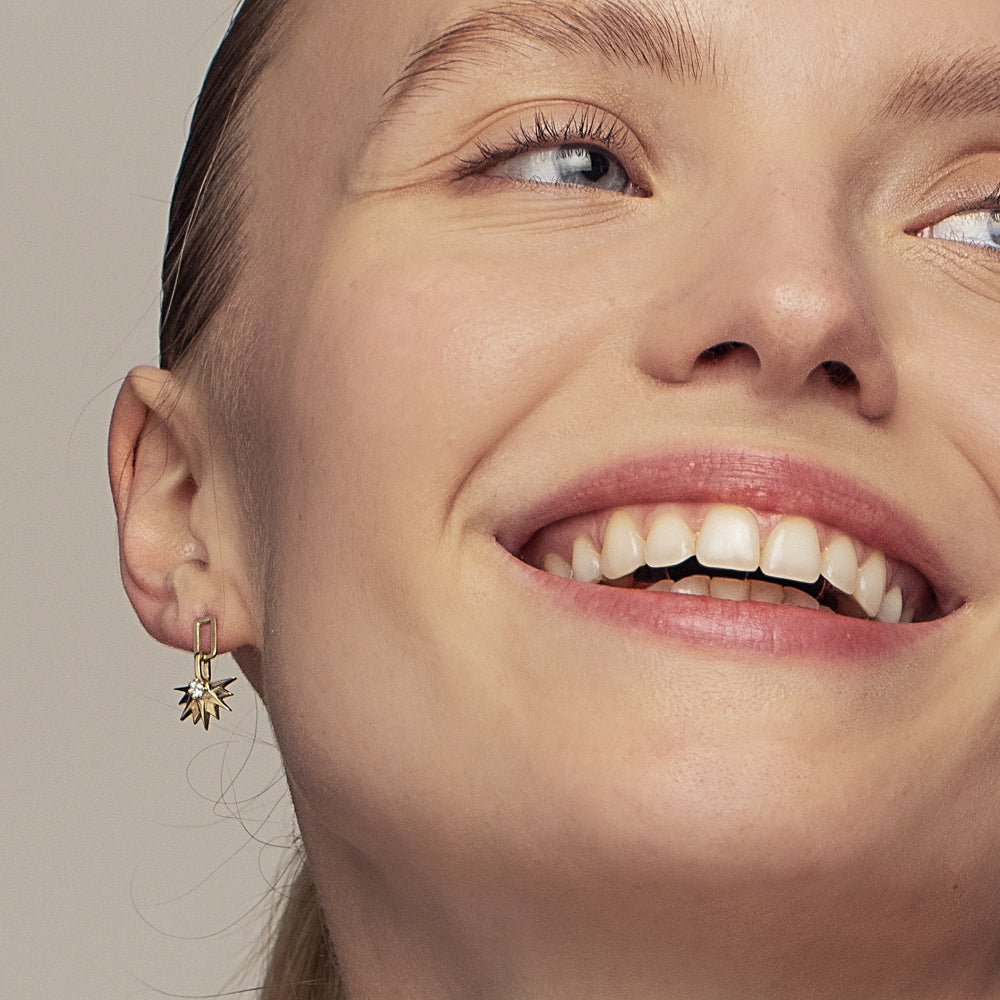 Hanging half-sun hoop earrings studded with laboratory diamonds