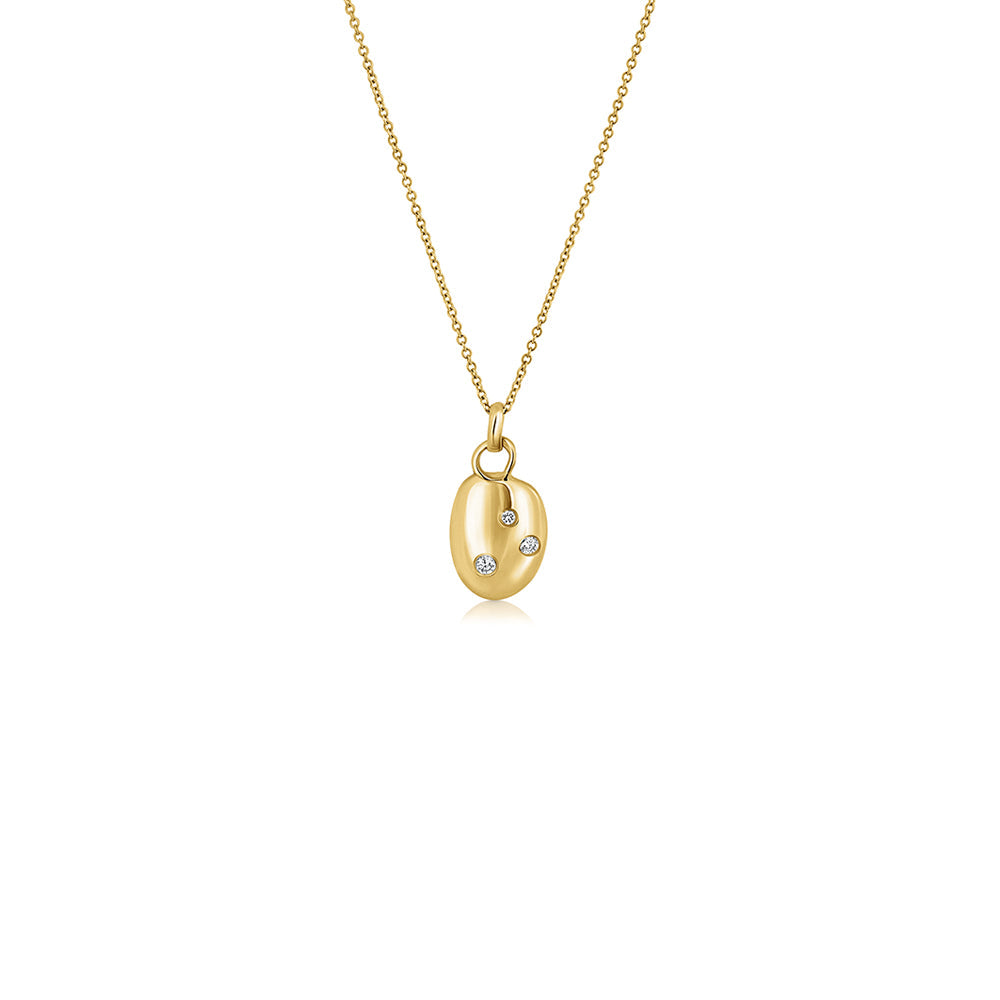 An amorphous gold chain set with three lab diamonds of varying sizes