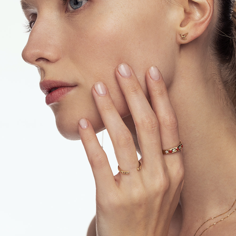 Open gold ring studded with rubies