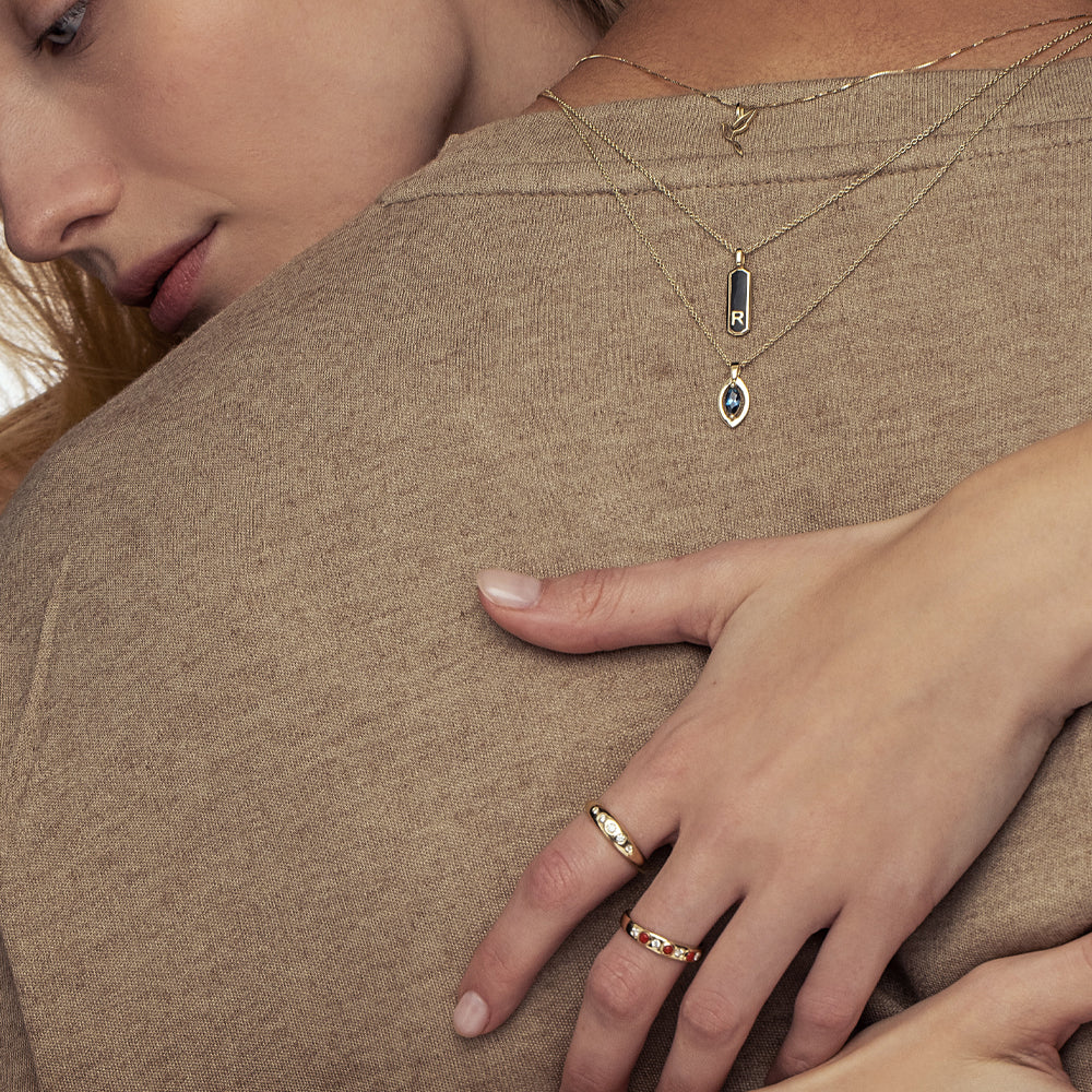 A gold ring set with 5 sunken laboratory diamonds