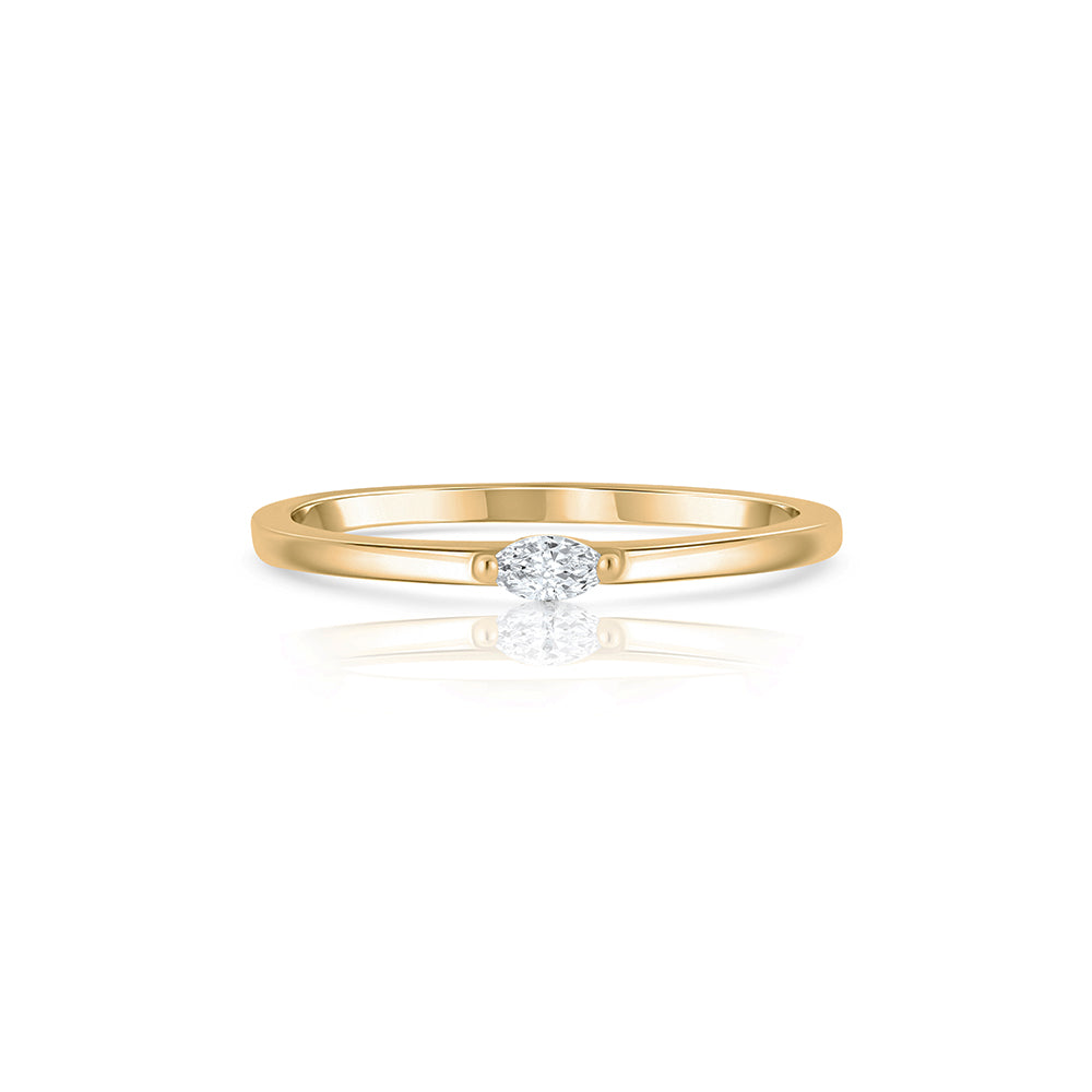 Fine gold ring set with a small marquise-cut lab diamond